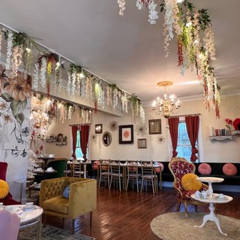 Lanier House Madison - tables, chairs, and flowers hanging from the ceiling - Tea Rooms Near Me - Madison, Alabama Lanier House Madison - tables, chairs, and flowers hanging from the ceiling - Tea Rooms Near Me - Madison, Alabama