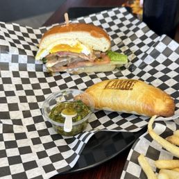 Chivito sandwich and Lamb empanada