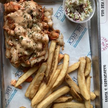 The Deck - Crawfish and shrimp sandwich with fries and slaw - New American Near Me - Tybee Island, Georgia The Deck - Crawfish and shrimp sandwich with fries and slaw - New American Near Me - Tybee Island, Georgia
