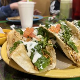 two tacos on a yellow plate