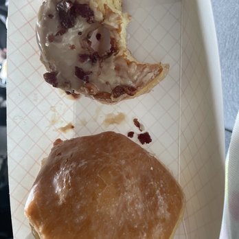 Lickin Good Donuts - Half devoured maple bacon doughnut and lemon filled doughnut - Delis Near Me - Centre, Alabama