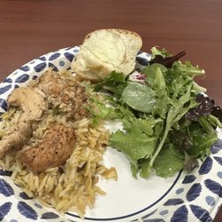 Famfare Kitchen - Lemon chicken with rice pilaf, fresh tossed salad with house made dressing and feta, fresh baked bread.