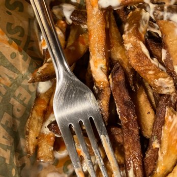Wingstop - a fork in a basket of fries - Chicken Wings Near Me - Chandler, Arizona Wingstop - a fork in a basket of fries - Chicken Wings Near Me - Chandler, Arizona