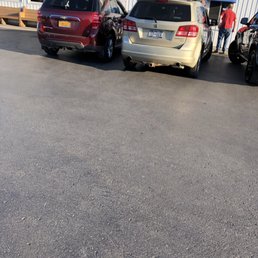 three cars parked in front of a building