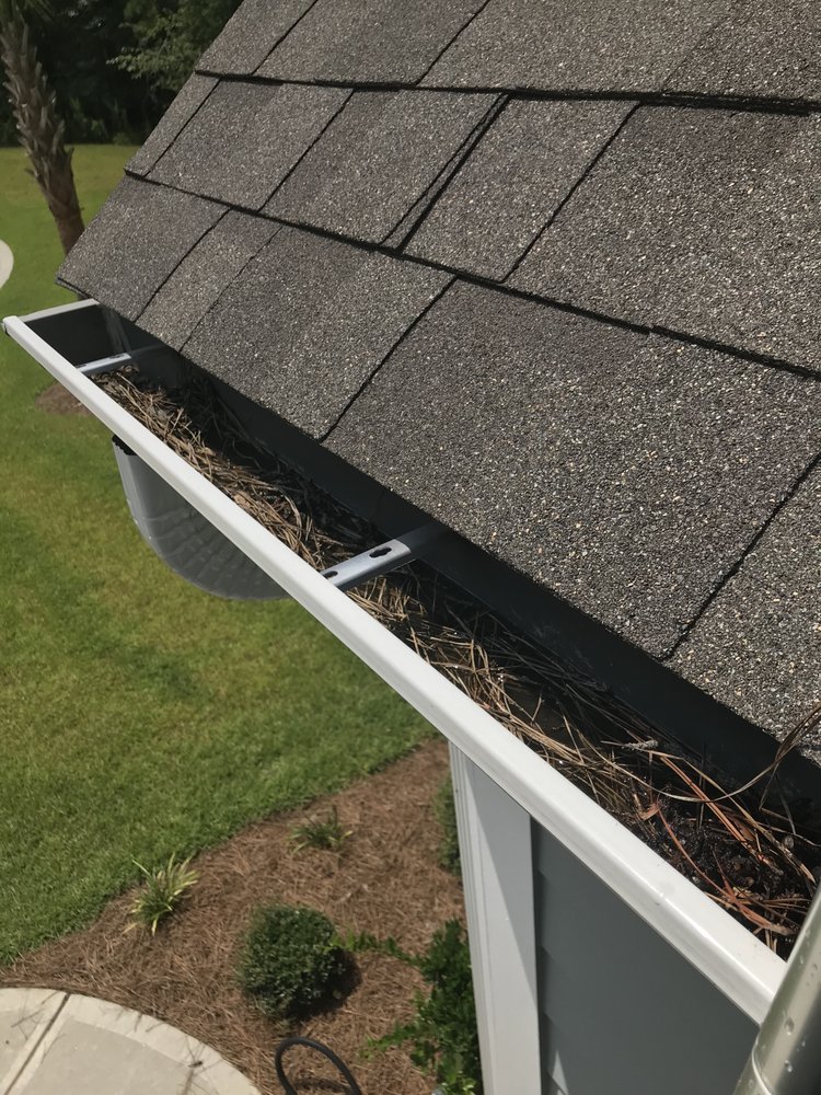 Slide of Gutter Clutter Cleaning & Roof Repair