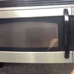 GE Caption Microwave By in Date of 2011.