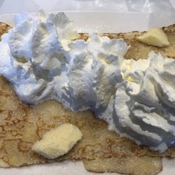 Crepe with butter sugar and whipped cream