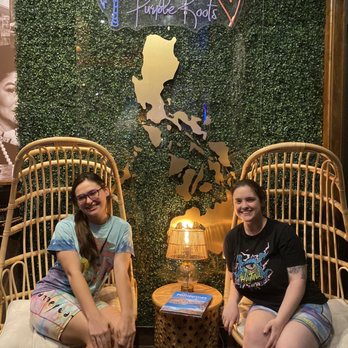 Purple Roots - Fun picture wall at the front of the restaurant! - Filipino Near Me - Jacksonville, Florida Purple Roots - Fun picture wall at the front of the restaurant! - Filipino Near Me - Jacksonville, Florida