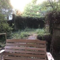 Cajun Country Cottages Bed & Breakfast - Magenta porch swing and privacy fence