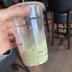 Maple Moose Coffee - Pale green sad matcha latte with oatmilk