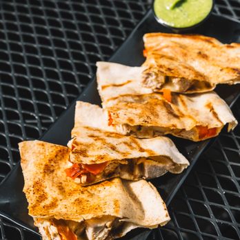 Anita's Kitchen - Chicken Pita Quesadilla - Chicken, peppers, onions, mozzarella, provolone, between pita bread, grilled until crispy. (soy-free, halal) - Lebanese Near Me - Ferndale, Michigan Anita's Kitchen - Chicken Pita Quesadilla - Chicken, peppers, onions, mozzarella, provolone, between pita bread, grilled until crispy. (soy-free, halal) - Lebanese Near Me - Ferndale, Michigan