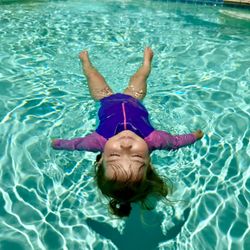 Swim Synergy - Resting in her survival float between her swim-float-swim across the pool.
