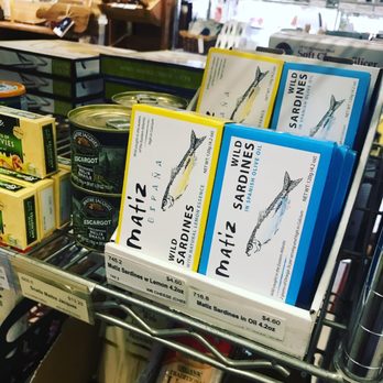 Atlantic Spice Co - a shelf of canned food - Coffee & Tea Near Me - North Truro, Massachusetts