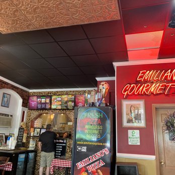 Emiliano's Pizza - a man standing at the counter - Pizza Near Me - Poughkeepsie, New York Emiliano's Pizza - a man standing at the counter - Pizza Near Me - Poughkeepsie, New York