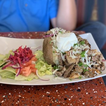 Potato Jackets - a plate of food on a table - Halal Near Me - Niagara Falls, Ontario Potato Jackets - a plate of food on a table - Halal Near Me - Niagara Falls, Ontario