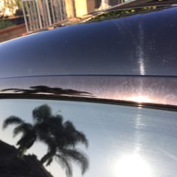 Damage to window trim from their car wash chemicals.