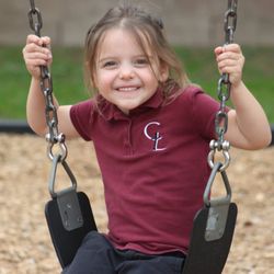 Christ Lutheran School - Student on swing set