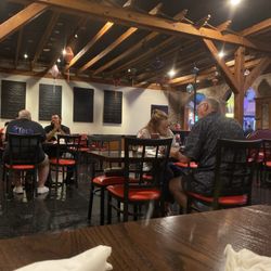 Noodles - Vibrantly red chairs and serene walls