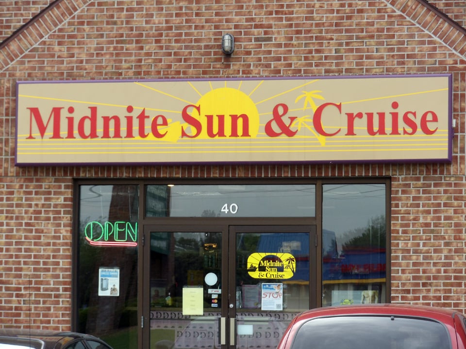 Midnite Sun - Grandville Kenowa Plaza Logo