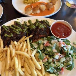 Skirt steak with French Fries.  Day boat sea scallops with risotto