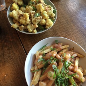 Finch & Barley - a bowl of fries and a plate of cauliflower - Middle Eastern Near Me - North Vancouver, British Columbia Finch & Barley - a bowl of fries and a plate of cauliflower - Middle Eastern Near Me - North Vancouver, British Columbia