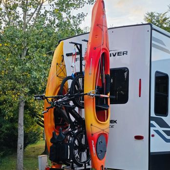RV Kayak Racks - electric bike hoist arms, one 12' kayak and one 9' 6" kayak on a fifth wheel Trailer. Another 5 star review not listed on Yelp! - Sporting Goods Near Me - Queensbury, New York RV Kayak Racks - electric bike hoist arms, one 12' kayak and one 9' 6" kayak on a fifth wheel Trailer. Another 5 star review not listed on Yelp! - Sporting Goods Near Me - Queensbury, New York