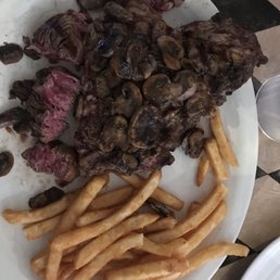 10oz ribeye topped with mushrooms.