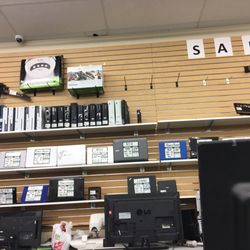 First Cash Pawn - Back wall of game consoles and computers