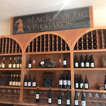 Black Knight Vineyards - shelves of wine bottles and wine glasses - Wineries Near Me Black Knight Vineyards - shelves of wine bottles and wine glasses - Wineries Near Me