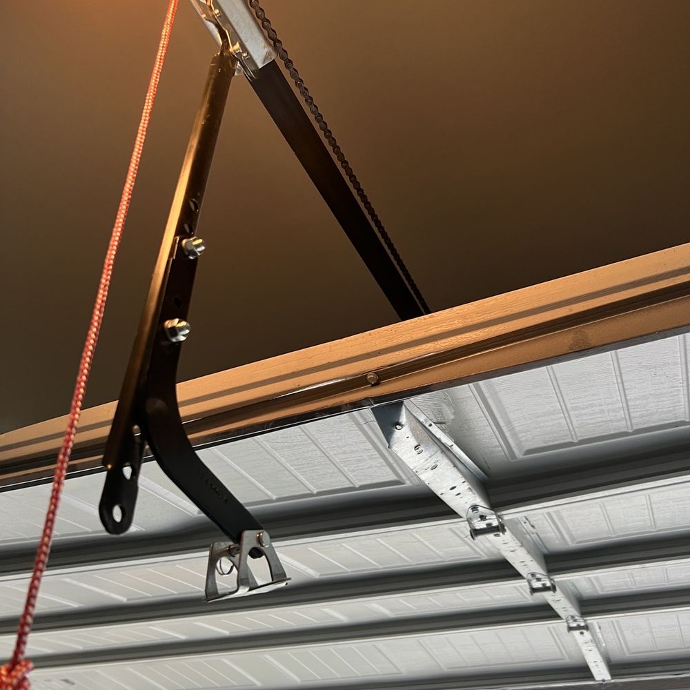 That black bar (typically attached) came off and had bent the garage door center frame. That black bar (typically attached) came off and had bent the garage door center frame.