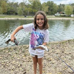 Lake Julian Trout Farm - Granddaughter with her catch!