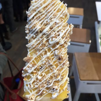 Popbar - Mango bar drizzled with white chocolate, almond, and caramel corn - Desserts Near Me - Anaheim, California