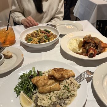 Nonna's The Trattoria - White fish with risotto, gemeli pasta, and lamb shank entree. - Italian Near Me - Ada, Michigan Nonna's The Trattoria - White fish with risotto, gemeli pasta, and lamb shank entree. - Italian Near Me - Ada, Michigan