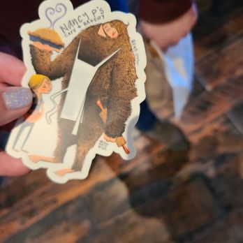 Nancy P's Cafe and Bakery - a person holding a sticker - Bakeries Near Me - Bend, Oregon Nancy P's Cafe and Bakery - a person holding a sticker - Bakeries Near Me - Bend, Oregon
