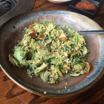 PERILLA korean fare - Brussel sprouts. My fiance hates brussel sprouts and he loved this dish! (This picture was taken after we ate a few spoonfuls) - Korean Near Me - Chicago, Illinois