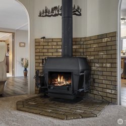 Every Door Real Estate - Comfy cozy wood stove in the living room.