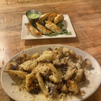 Nosh Eatery - Garlic parm cauliflower and pork potstickers - New American Near Me - Florence, Oregon
