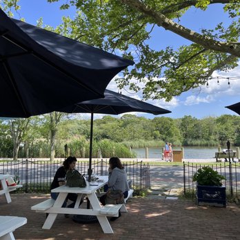 Turkuaz Grill - people sitting at picnic tables under umbrellas - Turkish Near Me - Riverhead, New York Turkuaz Grill - people sitting at picnic tables under umbrellas - Turkish Near Me - Riverhead, New York