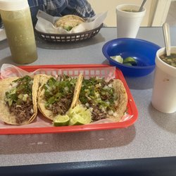 Birrieria Ocotlan - 3 Birria Tacos with chorizo, onions, lettuce, topped with lime juice and consume to dip the tacos in. With a Horchata to drink!