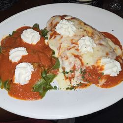 Caramellas Italian Bistro - Chicken parm, homemade spinach pappardelle, marinara, topped with fresh ricotta.