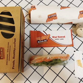 Wow Banh Mi & Pho - The banh mi to-go box and all the cutlery that go with it (wet napkin and floss toothpick). - Noodles Near Me - Norcross, Georgia