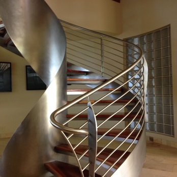 Creative Builders Maui - Custom Staricase. Modern spiral staircase with custom steel and wood craftsmanship. - General Contractors Near Me - Makawao, Hawaii