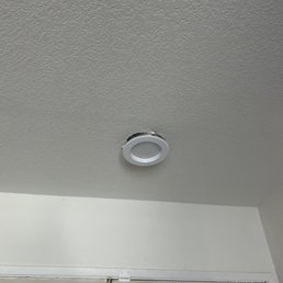 Our can light that was displaced during repiping with damage to the drywall all around it.