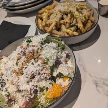 Minnie Olivia Pizzeria - Wedge salad, interestingly not wedge-shaped. My lover enjoyed. Also truffle fries with ranch on side. - Pizza Near Me - Alpharetta, Georgia