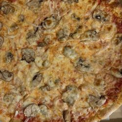 Di Matteo's Pizza Restaurant - Large red pizza with mushrooms and onions