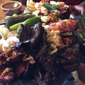 Puerto Vallarta - The loaded molcajete which has chicken steak and chorizo. Get one. - Mexican Near Me - Orange, Connecticut Puerto Vallarta - The loaded molcajete which has chicken steak and chorizo. Get one. - Mexican Near Me - Orange, Connecticut