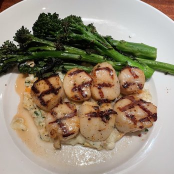 Seasons 52 - Caramelized Grilled Sea Scallops with risotto and summer squash and broccolini. - New American Near Me - Altamonte Springs, Florida Seasons 52 - Caramelized Grilled Sea Scallops with risotto and summer squash and broccolini. - New American Near Me - Altamonte Springs, Florida