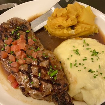 Mahoney's Atlantic Bar & Grill - NY Strip Steak with mashed potatoes and cooked squash. - New American Near Me - Orleans, Massachusetts Mahoney's Atlantic Bar & Grill - NY Strip Steak with mashed potatoes and cooked squash. - New American Near Me - Orleans, Massachusetts
