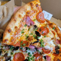 Basil Pizzeria - Big Slice of Delizia Pizza....fresh garlic!