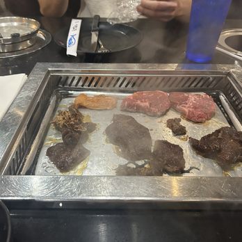 Hot Pot & BBQ - Cooking! It's a fire grill which I wasn't expecting - Hot Pot Near Me - Fort Myers, Florida Hot Pot & BBQ - Cooking! It's a fire grill which I wasn't expecting - Hot Pot Near Me - Fort Myers, Florida
